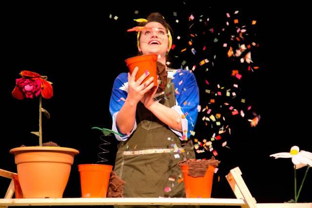 Image-of-woman-with-plant-pot-exploding-with-colourful-paper