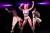 Zizi Strallen wearing pink wig dancing onstage